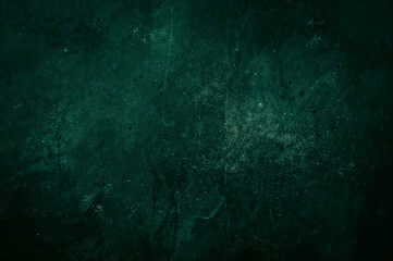 Naklejka premium Intriguing green grunge texture with subtle lighting, offering a versatile canvas for graphic designs and artistic explorations