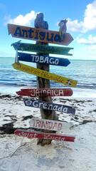 Colorful Island Signpost on a Caribbean Beach