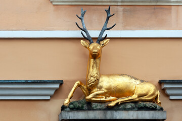 Golden deer on the old building facade in Wroclaw Poland
