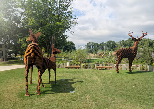 Raleigh, NC -  USA - 5-23-2025: Meadow of the Deer sculpture by artist Mark Reigelman at the Gipson Play Plaza in Dix Park
