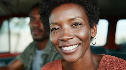 Happy couple enjoys road trip adventure together while traveling in vintage van