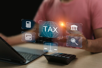 Online tax planning concept, Finance that must be deducted to the government, Man using a laptop to enter calculation data to report income to the Revenue Department, to pay taxes as required by law