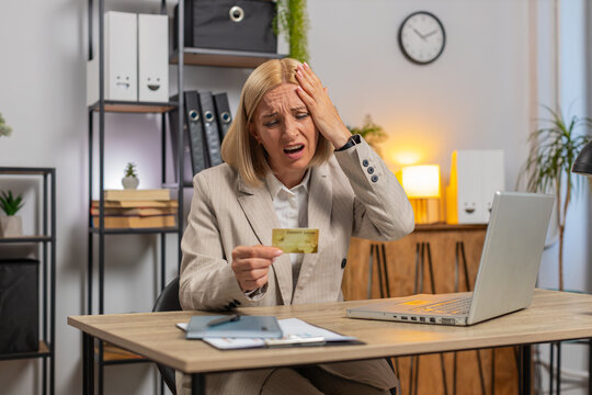 Angry mad stressed freelancer woman try to pay online shopping with blocked credit card smartphone. Annoyed middle-aged business lady buying bank refuse problem unsuccessful payment money lack balance