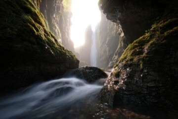 realistic waterfall photo with mist and sunlight