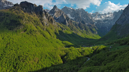 Obraz premium Rocky snow mountains before sunset aerial