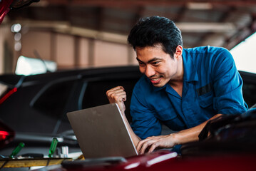 Car Mechanic Inspecting Car Engine Using Laptop for Vehicle Diagnostic in Auto Repair Garage, Professional Automotive Technician Checking Car System in Small Garage Business