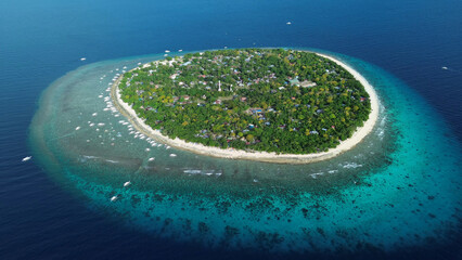 Tropical island with turquoise water and coral reef