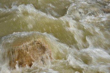Rapids that are formed suddenly in the Ialomita river by the spring rains. The Ialomita River in Romania flows from the Carpathian Mountains to the south