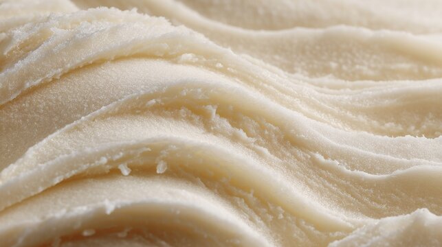 Premium photo of close up of organic shea butter creating a textured background with soft waves.