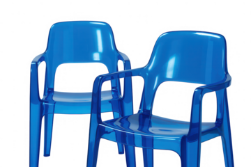 Two bright blue plastic chairs stand out against a transparent background in a studio shot