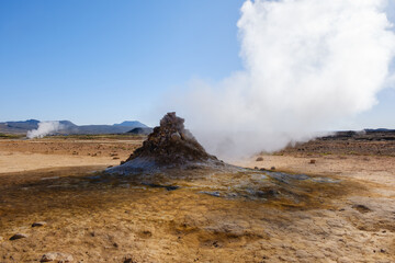 Steam rises from a geothermal hot spring in the Icelandic highlands, creating an otherworldly...