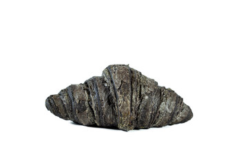 Black croissant isolated on white background.