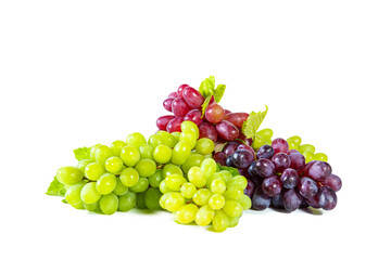 Bunches of green and red juicy grapes with leaves isolated on white.