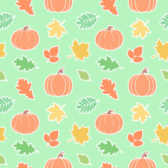 Seamless pattern of autumn leaves and pumpkins isolated on green background.