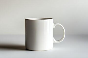 Obraz premium Simple White Ceramic Mug with Subtle Shadows on a Light Background