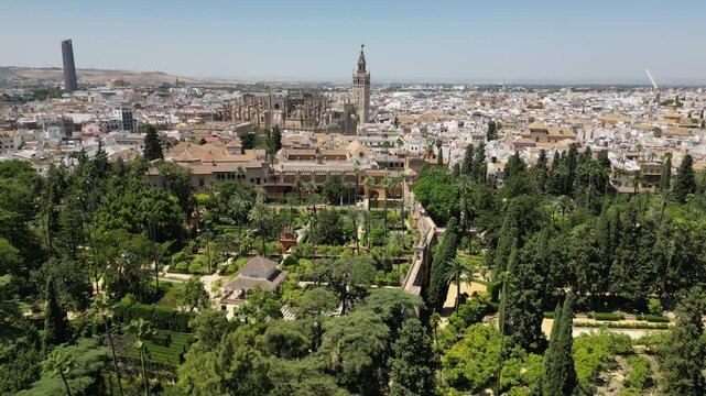 Aerial view from a drone of beautiful old Royal Alc&aacute;zar of Seville with garden in Seville, Spain in sunny summer weather