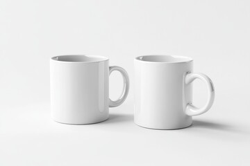 Fototapeta premium Two Plain White Mugs on a White Background