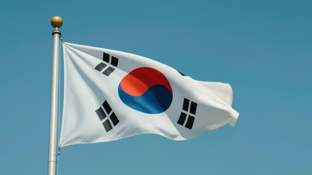 The national flag of South Korea, the Taegeukgi, waving in a gentle slow motion against a clear, vibrant blue sky on a sunny day, seamless loop.

 - Powered by Adobe