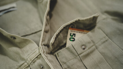 50 Euro Banknote Hidden in Shirt Pocket.Bribery Concept.