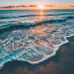 Blue Ocean at Sunset on Sandy Beach