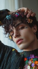 A nonbinary model experimenting with colorful hair clips and accessories at home 