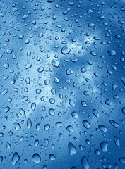 The water drops resting upon a smooth surface showcasing their beauty and details