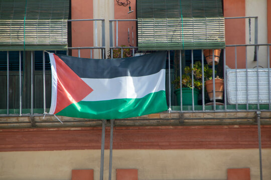 Palestinian Flag Hanging from Urban Balcony &ndash; Symbol of Solidarity and Identity