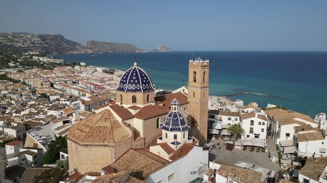 Aerial view from a drone of Altea&rsquo;s old town and iconic blue-domed church overlooking the Mediterranean Sea. Picturesque coastal village on Spain&rsquo;s Costa Blanca.