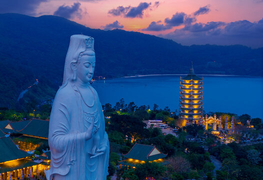 Serene sunset view of lady buddha statue and linh ung pagoda in Da nang, Vietnam