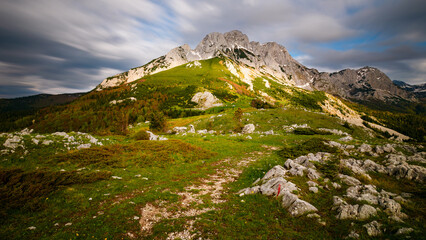 Fototapeta premium Bosanski Maglić from Prijevor in Bosnia on the border with Montenegro in the Sutjeska National Park. The highest mountain in Bosnia and Herzegovina with clouds in the sky