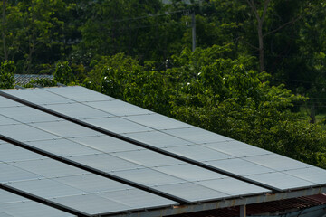 Solar panels row.Solar cells farm on the roof and sunset.Photovoltaic modules for renewable...