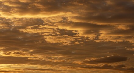 Obraz premium Golden Hour Sky Canvas - Serene sunset, vast sky, swirling clouds, peaceful atmosphere, golden light. Symbolizing tranquility, hope, warmth, dreams, and nature's beauty