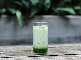Iced Matcha Latte on Wooden Table