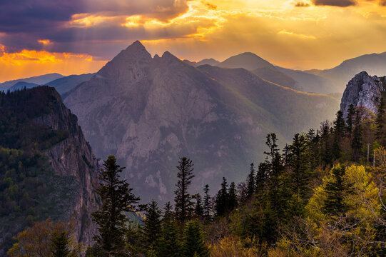 Sutjeska National Park in Bosnia and Herzegovina. Sunset in the mountains of Bosnia in the area of Prijevor and Veliki Maglic. Illuminated mountain massif on the border with Montenegro