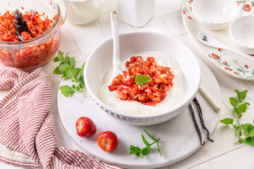 Preparing homemade strawberry jogurt with fresh fruits
