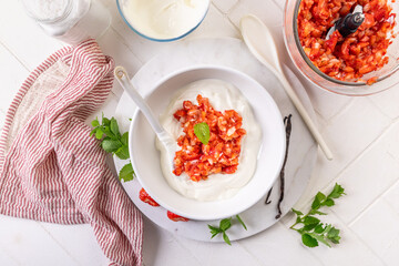 Preparing homemade strawberry jogurt with fresh fruits
