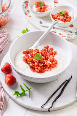 Preparing homemade strawberry jogurt with fresh fruits
