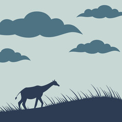 Giraffe Silhouette on Grassy Hill with Clouds