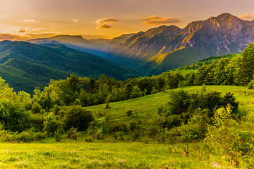 Sutjeska National Park in Bosnia and Herzegovina. Sunset in the mountains of Bosnia in the area of Prijevor and Veliki Maglic. Illuminated mountain massif on the border with Montenegro
