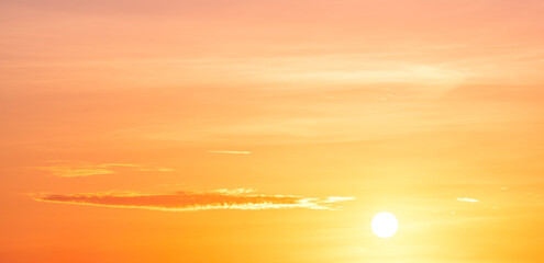 Sunrise sky with sun and yellow sunlight cloud on orange early morning panoramic background in golden hour time, Beautiful sunset summer panorama backdrop