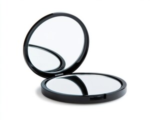A sleek, round black compact mirror opened to show two reflective surfaces on a white background.