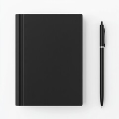A sleek, black hardcover notebook lies closed next to a matching black pen on a white surface.