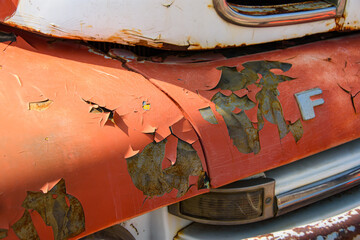 A 1950s vintage pick up is showing its age with peeling paint and rust  
