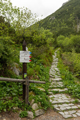  trail markers on the hiking path to Morskie Oko lake in Tatra Mountains near Zakopane, Poland, guiding through scenic alpine forest and mountain landscape © Point of view
