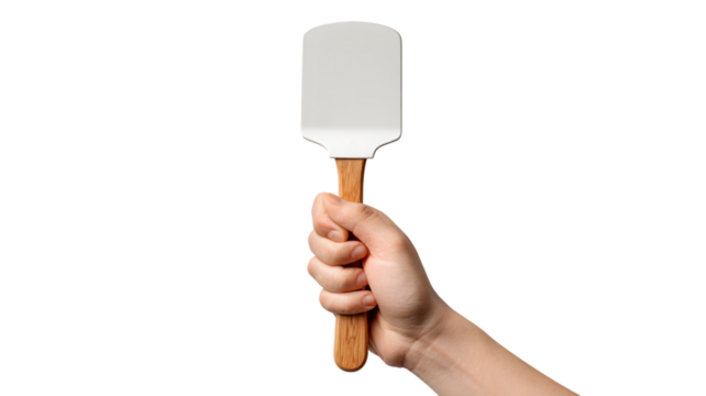 Hand holding a white spatula with wooden handle against a isolated on white transparent background depicting cooking and baking essentials 