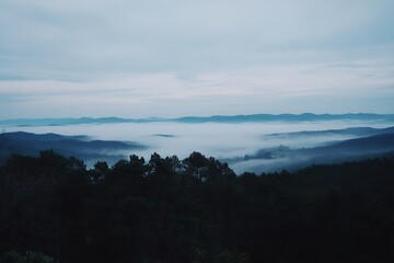 Misty layers between mountains in distance