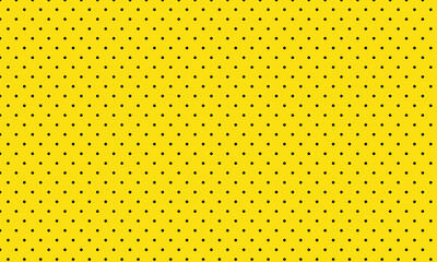 abstract simple black dot pattern on yellow can be used background.