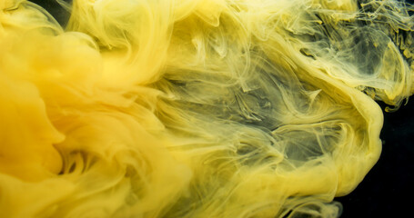 Mist wave. Fog ink swirl. Yellow paint blending in art defocused fluid. Stream color pigment curl explosion abstract black background.