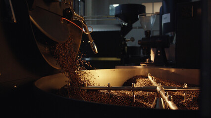 Coffee beans roasting and pouring in a coffee