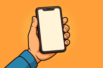 Hand holding a smartphone with a blank white screen in pop art comic style. Mobile phone mockup template for application or website design. Retro vector illustration with copy space.